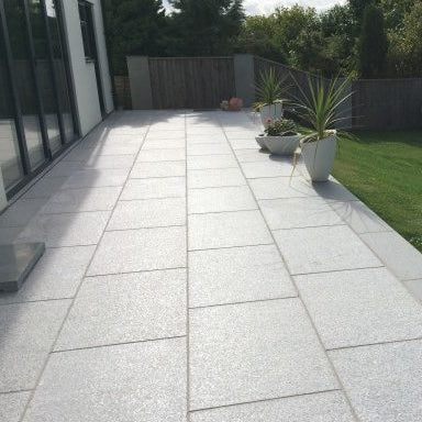 Gray stone patio with a grid pattern